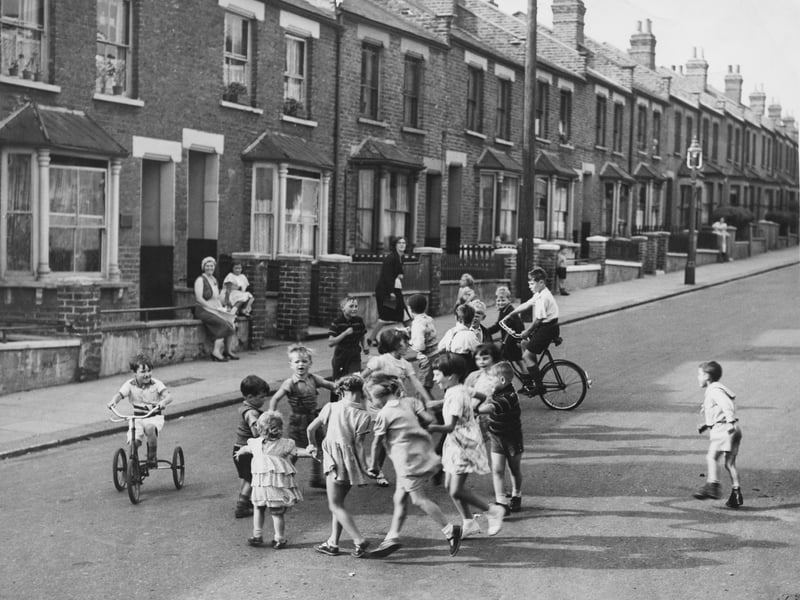Children playing on the street in around 1950 with not a car in sight
