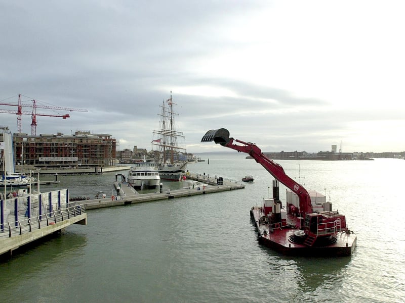Construction for the Millennium Tower at Gunwharf Quays is started with the dredging of the seabed.