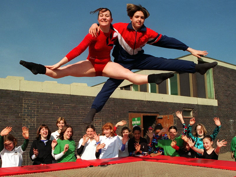 Rachael Crowther and Paul Greaves demonstrate their winning trampoline skills at Meadowhead School, Sheffield, with members of the school trampoline team