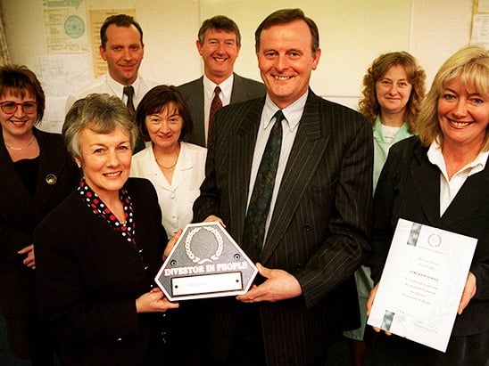 Yewlands School headteacher Pat Whitaker and senior teacher Moira Twigg receive the Investor in People award from Keith Davey, chief executive of the Sheffield TEC, in 1997. At the back, from left to right, are Corrine Templeman, Derek Dawson, Pauline Grange, George Fewster and Pat Smedley.