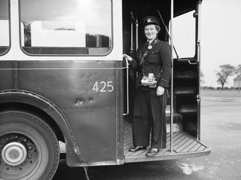 Bus conductress Jessie Skimming with her ticket machine in Edinburgh in October 1956.