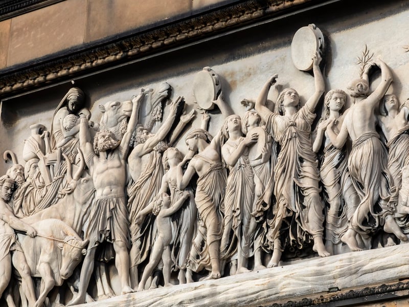 There are two marble panels showing "The Overthrow of Pharaoh in the Red Sea" (South facing panel) and "The Song of Moses and Miriam" (North facing panel)
