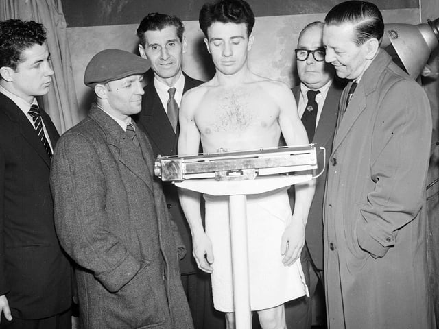 Scottish boxer Hugh Riley at a weigh-in in March 1956.