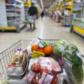 Food items in a shopping trolley inside a Tesco supermarket store. The retailer is hiring over 28,500 temporary staff across the UK for the Christmas period (Photo: DANIEL LEAL/AFP via Getty Images)