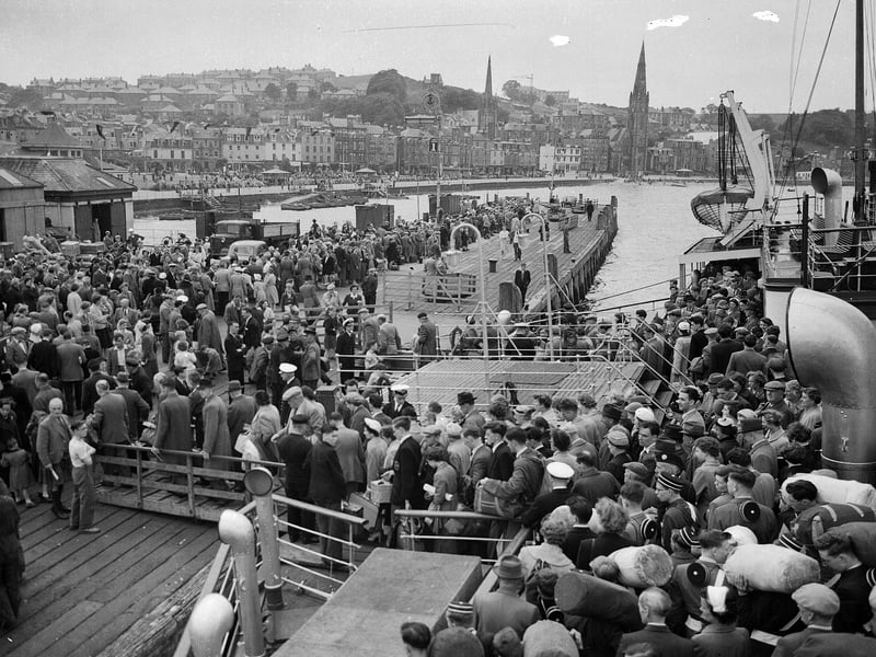 Crowds of holidaymakers coming ashore at Rothesay pier on July 17, 1956, for the Glasgow Fair holiday.