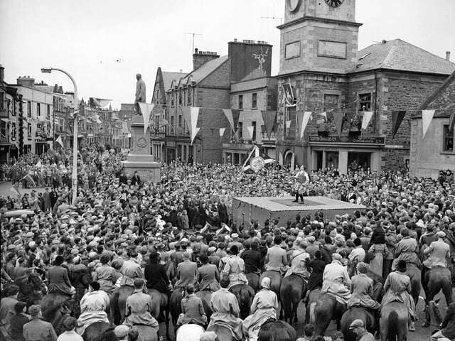 The flag bearer casts the colours at the Selkirk Common Riding in 1954.