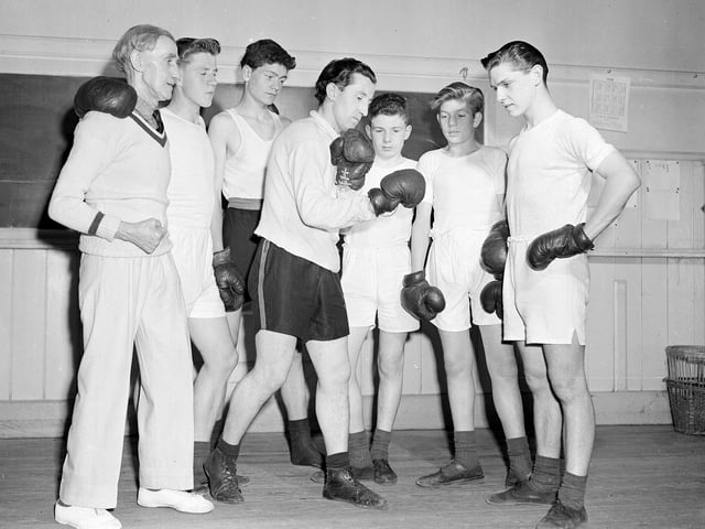 Boys being taught boxing by Professor Paddy Fee and at the Donaldson School for Deaf.