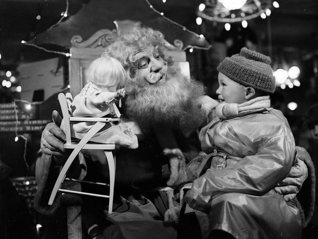 Santa Claus with a little boy in Edinburgh's Jenners department store in 1954.