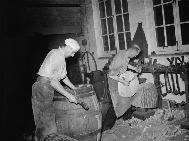 Coopers making barrels at Whitbread Brewery, in the City of London, in November 1953. Whitbread was founded as a brewery in 1742, and by 1780 had become the world's largest brewery. The firm sold its breweries to Interbrew in 2001 and today specialises in hospitality, with brands including Premier Inn hotels and Beefeater restaurants. The old Whitbread Brewery on Chiswell Street is now a conference and events venue.