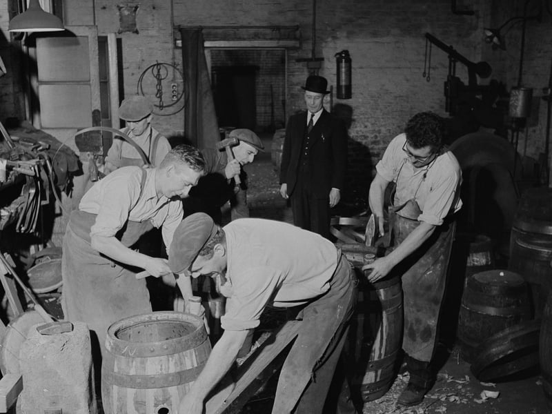 Coopers making wooden casks at Charrington's Anchor Brewery, on Mile End Road, London, in November 1957