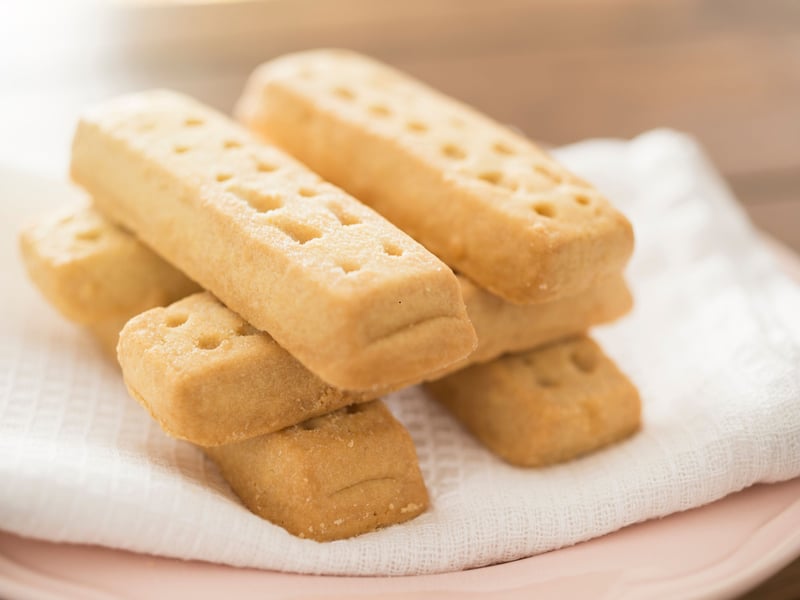 Shortbread is a biscuit that has evolved, rather by being invented by a single person - but there's no doubt that its history is completely Scottish. Originally a fairly tasteless 12th century twice-baked 'biscuit bread', the court bakers of Mary, Queen of Scots are credited with transforming it into a luxury snack by adding lashings of expensive butter and sugar in the 16th century. It's not changed much more in the last 500 years.