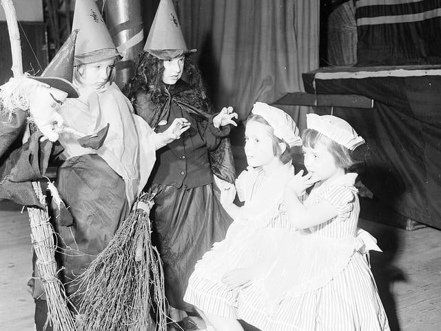 A couple of witches casting a spell at the Old St Pauls Brownies Halloween party in Church Hall, Jeffrey Street, Edinburgh, in 1961.