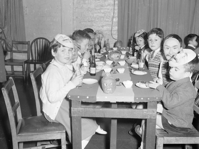 A Halloween Party  for orphans with turnip lanterns on the table in Edinburgh in 1962.