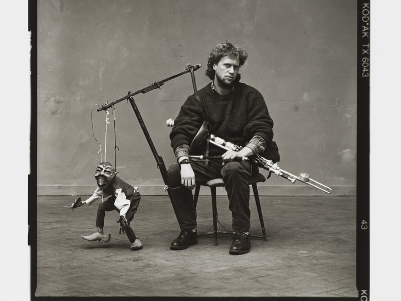 Photograph entitled 'Man with Irish pipes and mannequin' from The Buskers Portfolio Oct 1993 by David Eustace