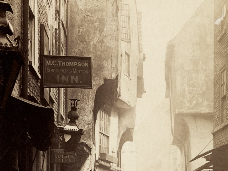 The Shambles, York, in or around the 1890s, with the pub sign for the Shoulder of Mutton Inn (landlord MC Thompson) hanging in the left foreground