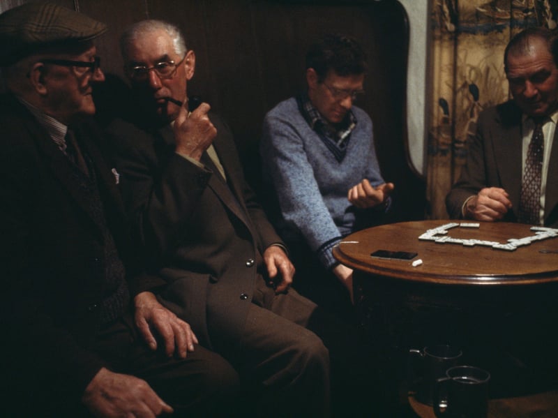A group of men play dominoes in the Victoria Arms, in Worton, Yorkshire, in around 1982