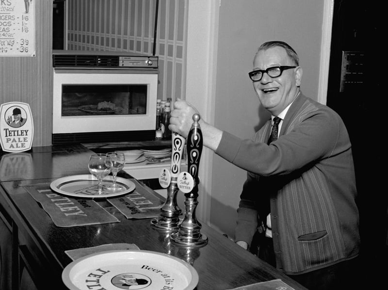 Pub landlord Jack Watson with his newly installed microwave oven in the Bull's Head, Mexborough, South Yorkshire, in 1968