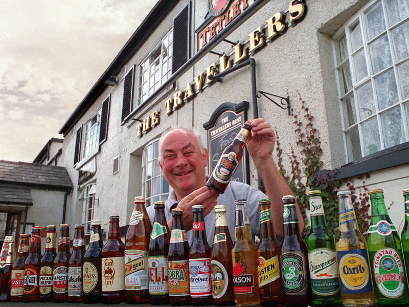 Brian Pashley, of the Travellers Rest pub, East Keswick, with his bottles of beer from around the world, in 1999