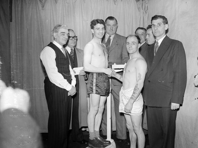 Boxers Eddie Carson and Hugh Riley at a weigh-in before their bout at the Eldorado stadium in Leith, October 1953.