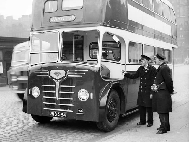 Edinburgh's latest double decker bus is examined by a driver and a conductor at Shrubhill depot. The bus was one of 60 that were bought from London and reconditioned and rebodied.