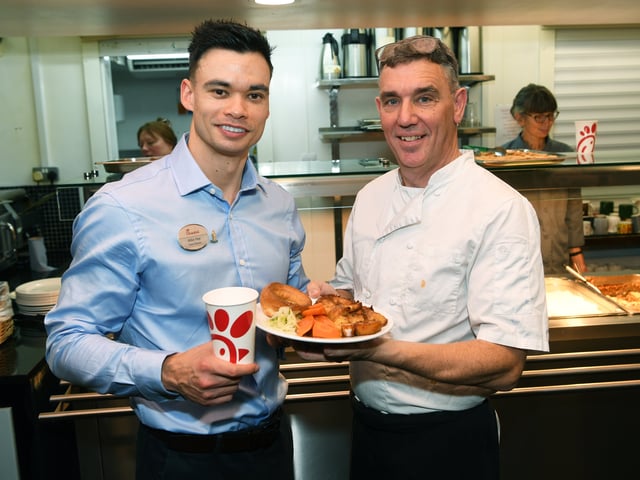 Crypt chef Dave Pilling, right, with food donated by Chick-fil-A and Mike Hoy, the owner-operator of the new Leeds restaurant.