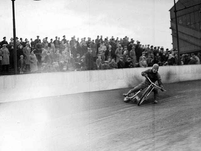 Speedway rider Bob Mark takes a corner at Meadowbank during Edinburgh Monarch's pre-season trials in 1953.