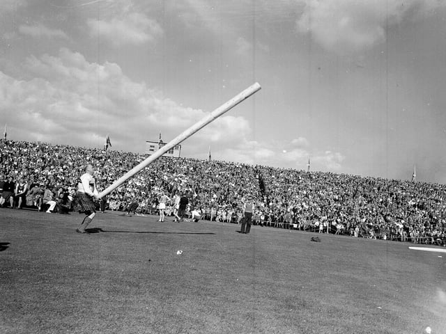 Tossing the caber at the 1953 City of Edinburgh Highland Games at Murrayfield Stadium.