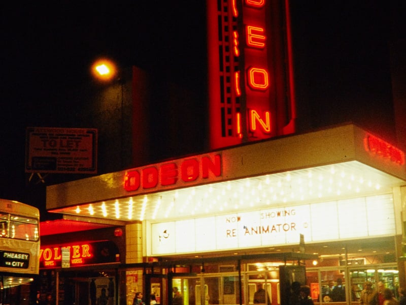 The Odeon Cinema, on New Street, Birmingham, in the mid-80s, showing the illuminated tower sign and billboard. It originally opened as a Paramount Theatre in 1937.