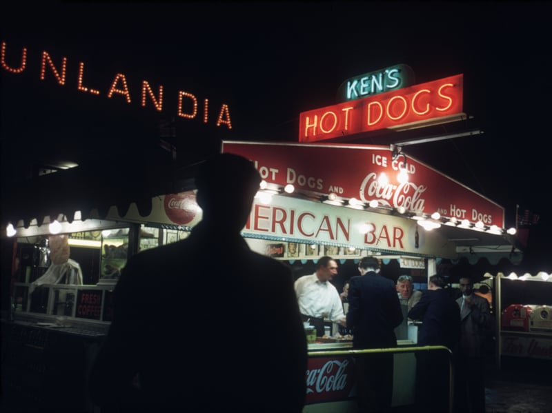 A shadowy customer approaches Ken's Hot Dogs stand in Blackpool in 1955