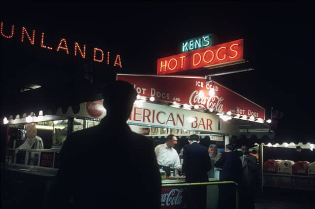 A shadowy customer approaches Ken's Hot Dogs stand in Blackpool in 1955