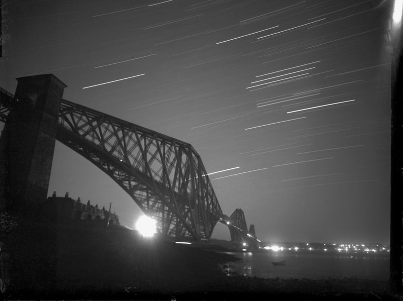Star trails seen above the Forth Rail Bridge, which connects Edinburgh with Fife, in October 1957