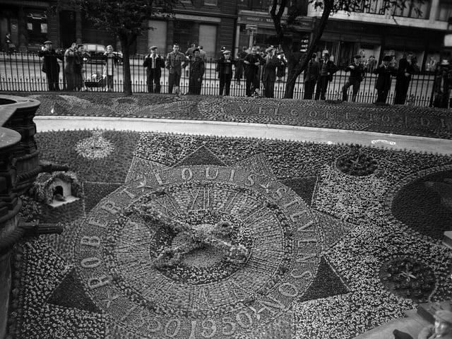 The Floral Clock at Edinburgh's West Princes Street Gardens commemorating the 100th anniversary of the birth of Robert Louis Stevenson in 1850. It included a "cuckoo display" (top left) which activated every quarter of an hour.