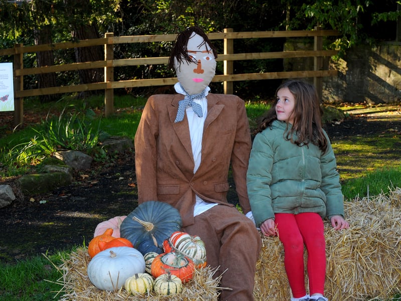 Seven-year-old Freya Smith from Horsforth meets up with a scarecrow.