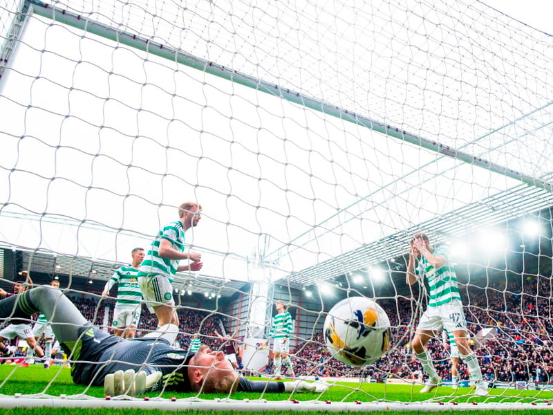 Celtic's Dane Murray (R) looks dejected after scoring an own goal 
