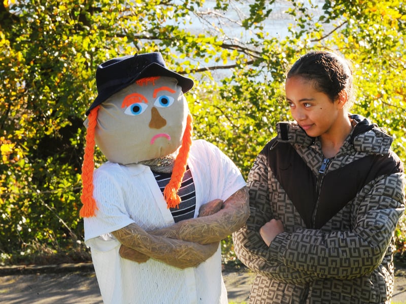 Laila Demonez, 11, from Moortown has fun with a scarecrow.