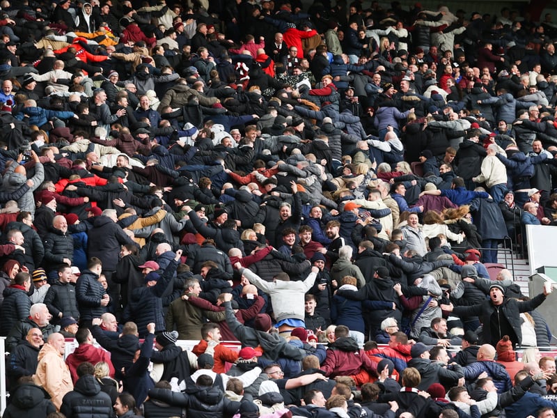 Hearts fans celebrate the win with the famous Poznan celebration.