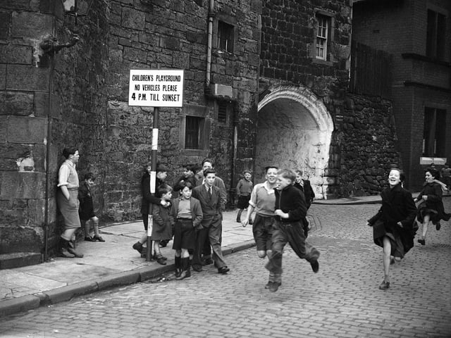 Children running on Johnston Street, Leith, where all traffic had been banned after 4pm to create a designated playground in 1952.