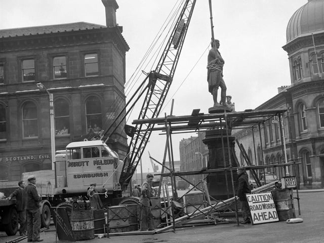 The Robert Burns statue in Constitution Street, Leith, -being removed for cleaning in August 1961.