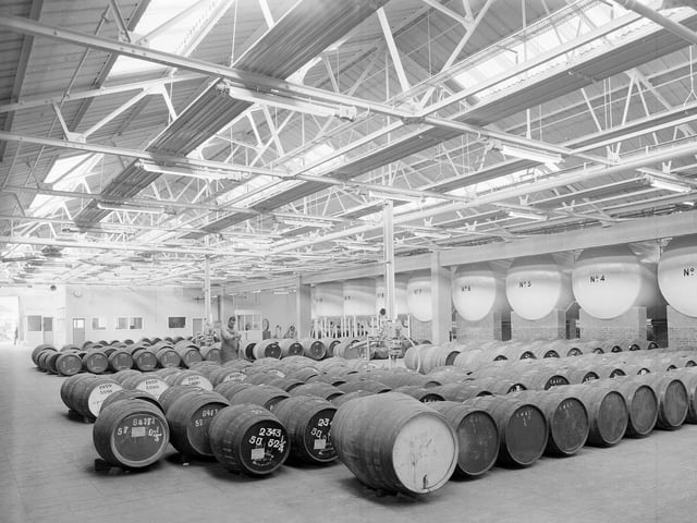 Vats and casks of whisky in the Scottish and Newcastle Brewerie's Bottling and Blending Warehouse in Leith's Bath Street in November 1963.