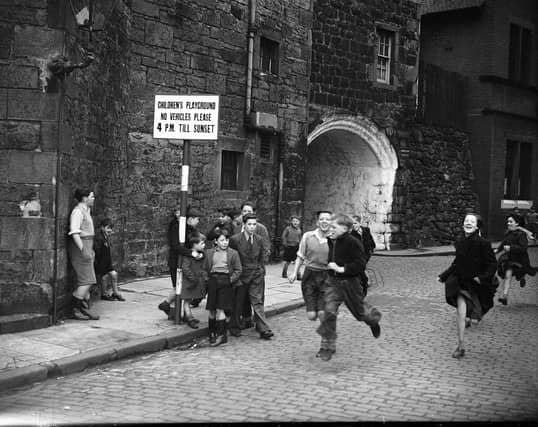 Children running on Johnston Street, Leith, where all traffic had been banned after 4pm to create a designated playground in 1952.