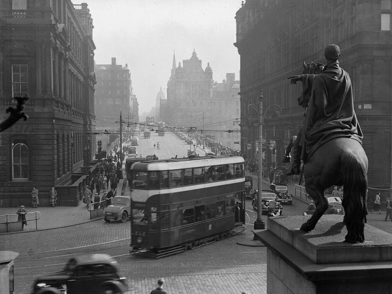 A tram turning into North Bridge at the east end of Princes Street in April 1952.