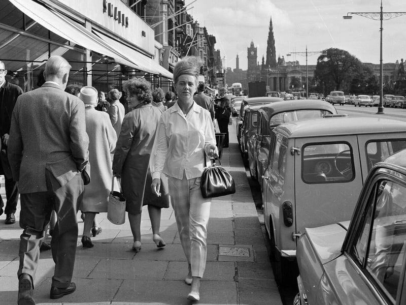 A fashionable woman in Capri pants and a striped shirt, photographed in Princes Street in September 1964.