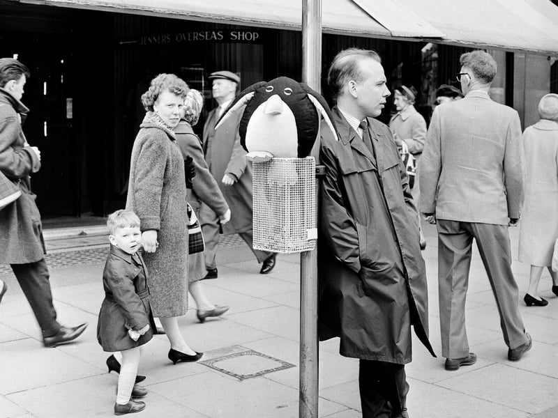 Edinburgh Dispatch reporter John Gibson at a bus stop on Princes Street with the hottest toy of the year - a gonk.