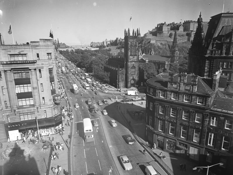A view of Princes Street from the West End, showing the bottom of Lothian Road, the Rutland Hotel, Binns department store, St John's Church and Edinburgh Castle taken in August 1966.
