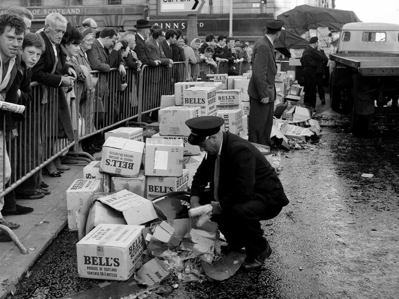 Lorries spill their load of Bell's whisky outside Binns department store at the West End of Princes Street in 1961.