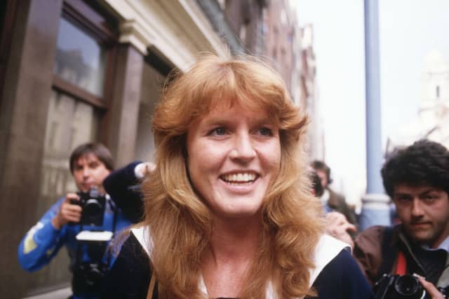 Sarah Ferguson (later Duchess of York) is surrounded by press photographers as she arrives for work in Mayfair, London on March 3, 1986. The announcement had just been made of her engagement to Prince Andrew. (
