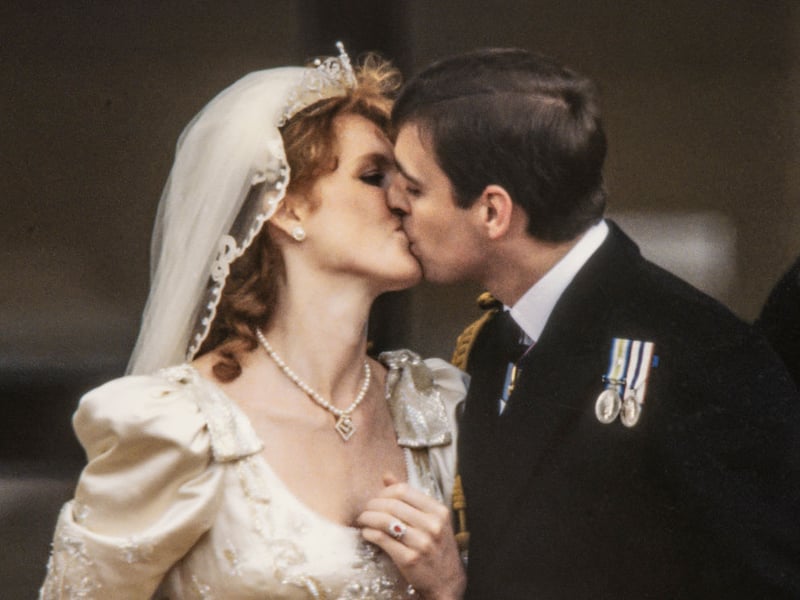 Sarah Ferguson kisses her new husband Prince Andrew on July 23, 1986