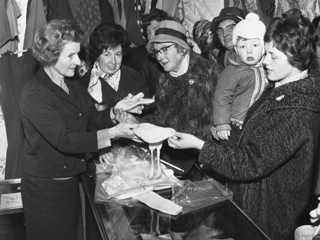 The opening of the new 'Cum 'n' Bye' charity shop at 115 High Street, Portobello, in March 1966.