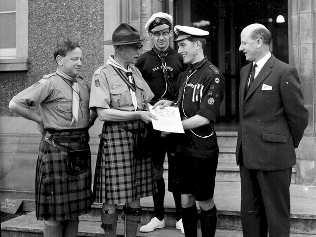 Troop Leader AG Johnston receives the Queens Scout Award at the Parents Night of the 12th Portobello Boy Scouts in May 1965.