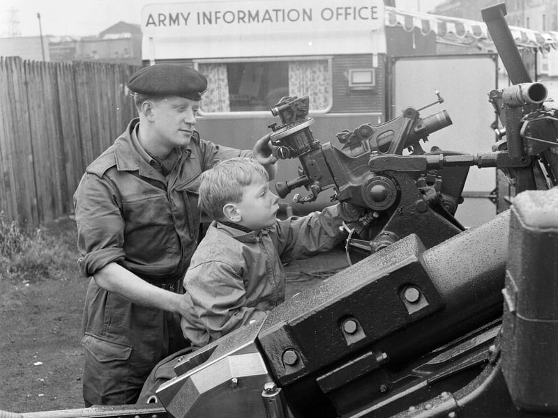 Young David Mitchell being shown round the Army Recruiting Campaign in Portobello's High Street in August 1964.
